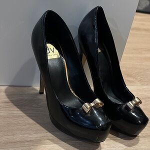 Dolce Vita Black Patent Platform Pumps with Gold Bow Accent